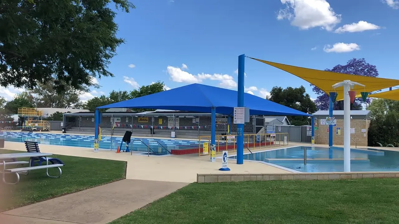 Outdoor pool and shaded splash area at Parkes Aquatic Centre